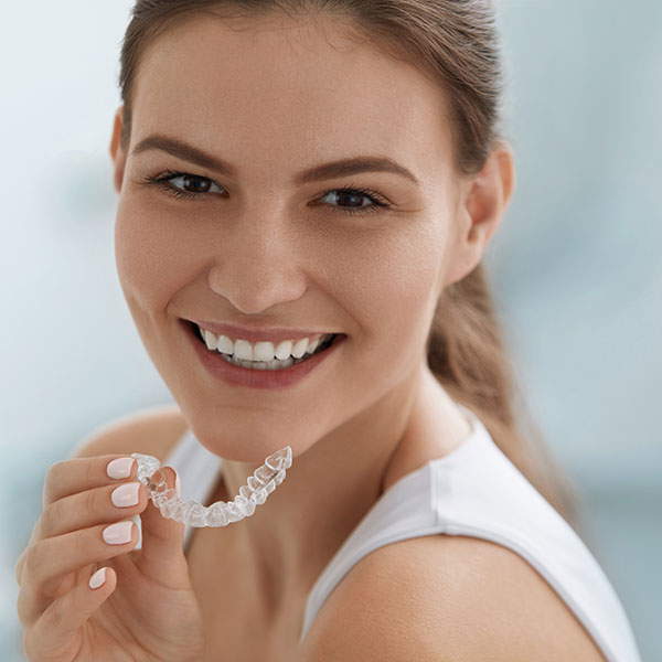 Young Woman with Invisalign Clear Aligner
